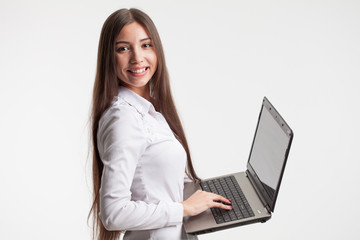 young businesswoman using laptop, isolated on white background