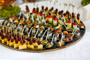 Steel spoons with salty snacks