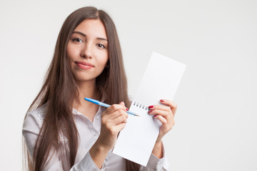 Success in business, job and education concept.Portrait of young beautiful businesswoman with clipboard writing, on white background
