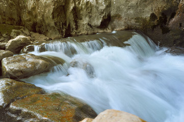 River cascading through the rocky river bed, environmental zen image