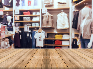 Wooden board empty table blurred background. Perspective brown wood over blur in department store - can be used for display or montage your products.Mock up for display of product.