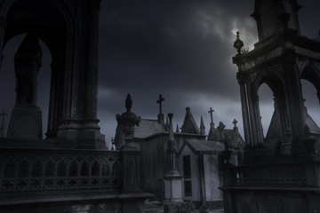 Fototapeta premium cemetery in an overcast full moon night