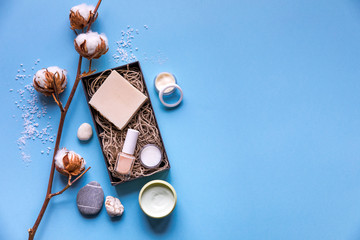 Beauty gift box. Spa relax salon day flatlay with clay, sea salt, cream, soap, cotton flowers