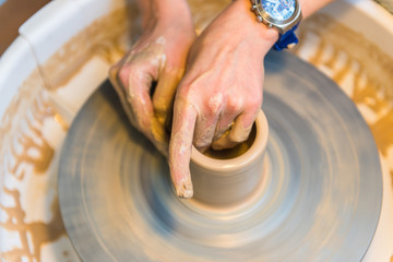 Pottering - creating a clay cup in process