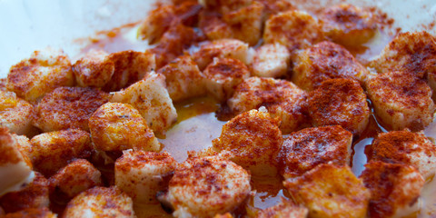 Galician style coocked octopus with paprika and olive oil. Pulpo a la gallega. Spanish tapas dish.
