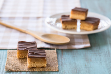 Chocolate Caramel Millionaire Bars Cookies Candy With Spoon