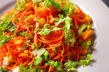 Plate with delicious spicy carrot spaghetti, close up