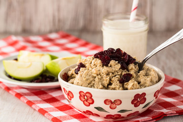 Oatmeal With Spoon and Glass of Milk