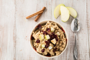 Breakfast Cereal Oatmeal With Apples Cranberries and Cinnamon Sticks