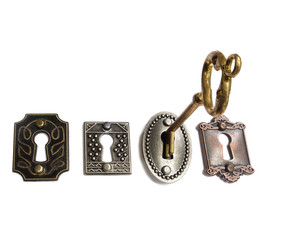 Gold key and locks on white