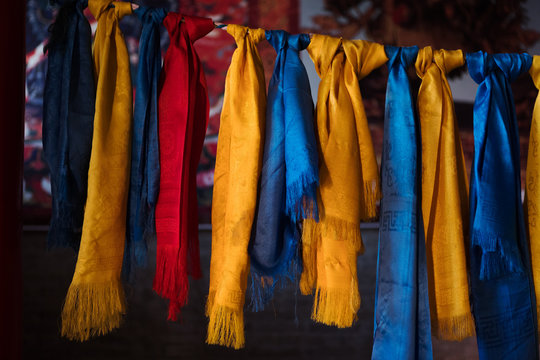 Colorful silk tied to a rope in a Buddhist temple