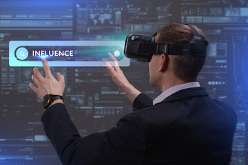 Business, Technology, Internet and network concept. Young businessman working on a virtual screen of the future and sees the inscription: Influence