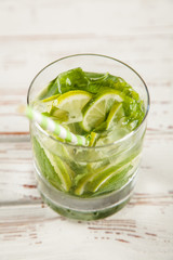 Mojito cocktail on white wood background