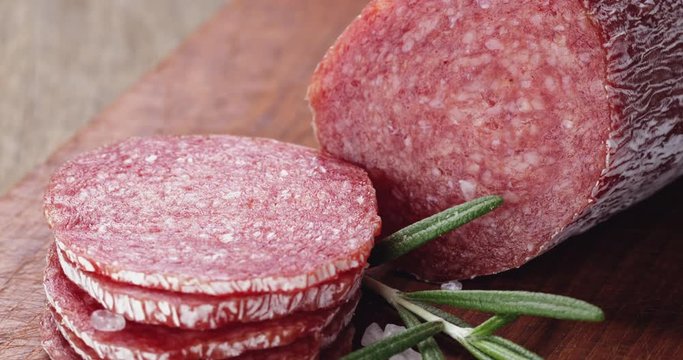 italian salami sausage slices with rosemary and sea salt