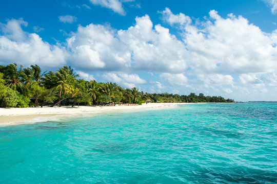 Beautiful cloudy panoramic landscape of sandy beach in Indian ocean, Maldives