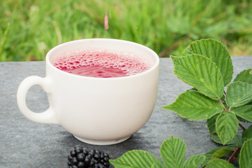 Cup of tea and blackberry