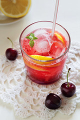 Homemade cherry lemonade with mint in glasses