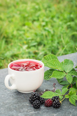 Cup of tea and blackberry