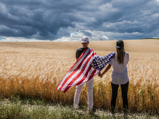 young couple with US Flag