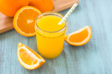 Orange Juice In Mason Jar With Straw
