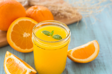Glass of Fresh Orange Juice With Mint Leaf