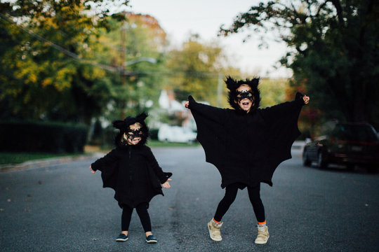 two children dressed as bats for halloween