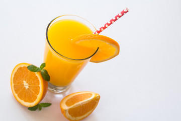 Glass of Fresh Orange Juice With Heart Straw on White