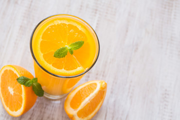 Orange Juice In A Glass With Mint Leaf From Above