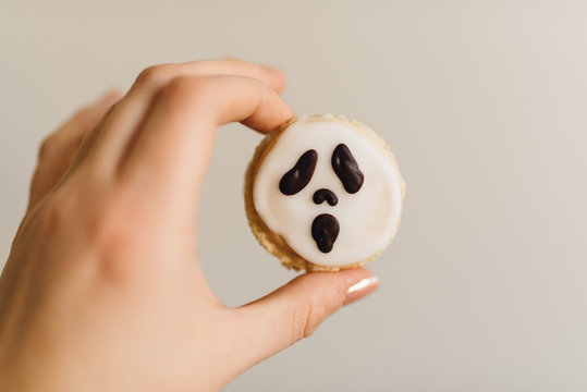 French macarons with ghost faces for halloween