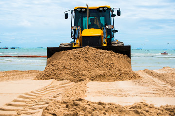 Excavator, ground and sand digger, beach