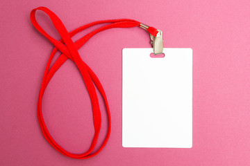 Name tag mockup isolated on pink background. Plain empty badge id mock up hanging on neck with red...