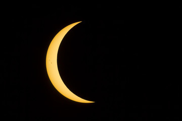 Fototapeta na wymiar Eclipse Crescent Sun with Sunspots