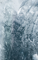 Frosty patterns on glass in winter
