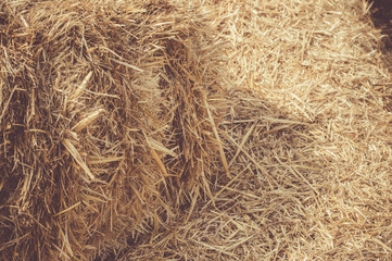 Closeup of hay bales in a village.