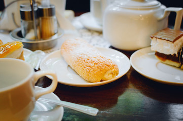Eclair cake in the cafe. Closeup, selective focus.