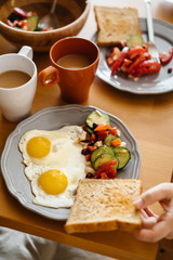 In the morning Breakfast is two eggs, toast, salad and coffee.