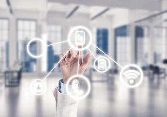 Modern office interior and close of businesswoman hand choosing 