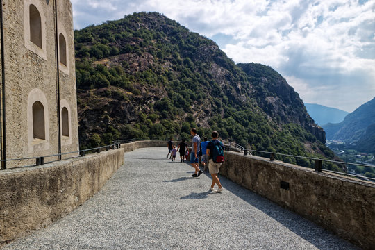 Fort Bard, Valle d'Aosta, Italy - August 18, 2017: Historic military construction defence Fort Bard. Touristic medieval fortress in Italian Alps. Location of the Avengers: Age of Ultron film.