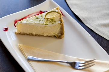 Close-up view of a dessert with a fork on a plate lying on a table
