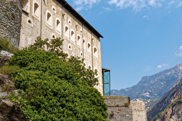 Obraz premium Fort Bard, Valle d'Aosta, Italy - August 18, 2017: Historic military construction defence Fort Bard. Touristic medieval fortress in Italian Alps. Location of the Avengers: Age of Ultron film.