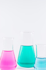  research, science and clinic background. 96 well micro plate and  laboratory beakers with colorful...