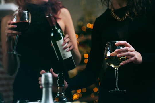 NYE: Woman Getting Glass Of White Wine At Holiday Party