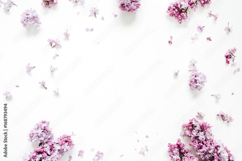 Wall mural frame of lilac flowers with space for text on white background. flat lay, top view