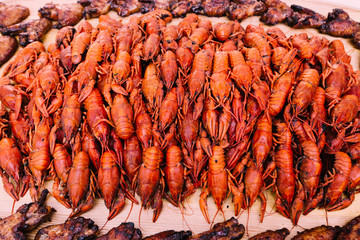 A large tray with red crawfish