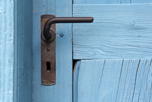 closeup of blue door with old doorhandle