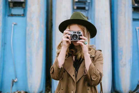 Fashionable Woman Taking Pictures With Analog Camera