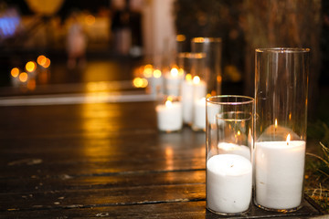 the steps are decorated with glass candlesticks.