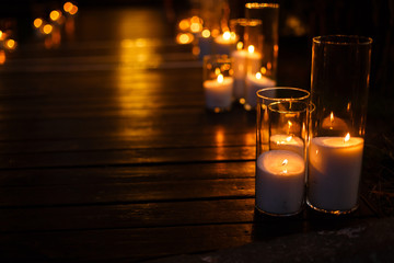 the steps are decorated with glass candlesticks.