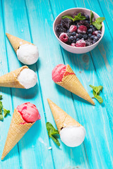 Waffle cones for ice cream on blue wooden table. Summer
