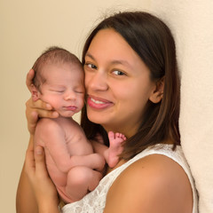 Tender mom with newborn baby